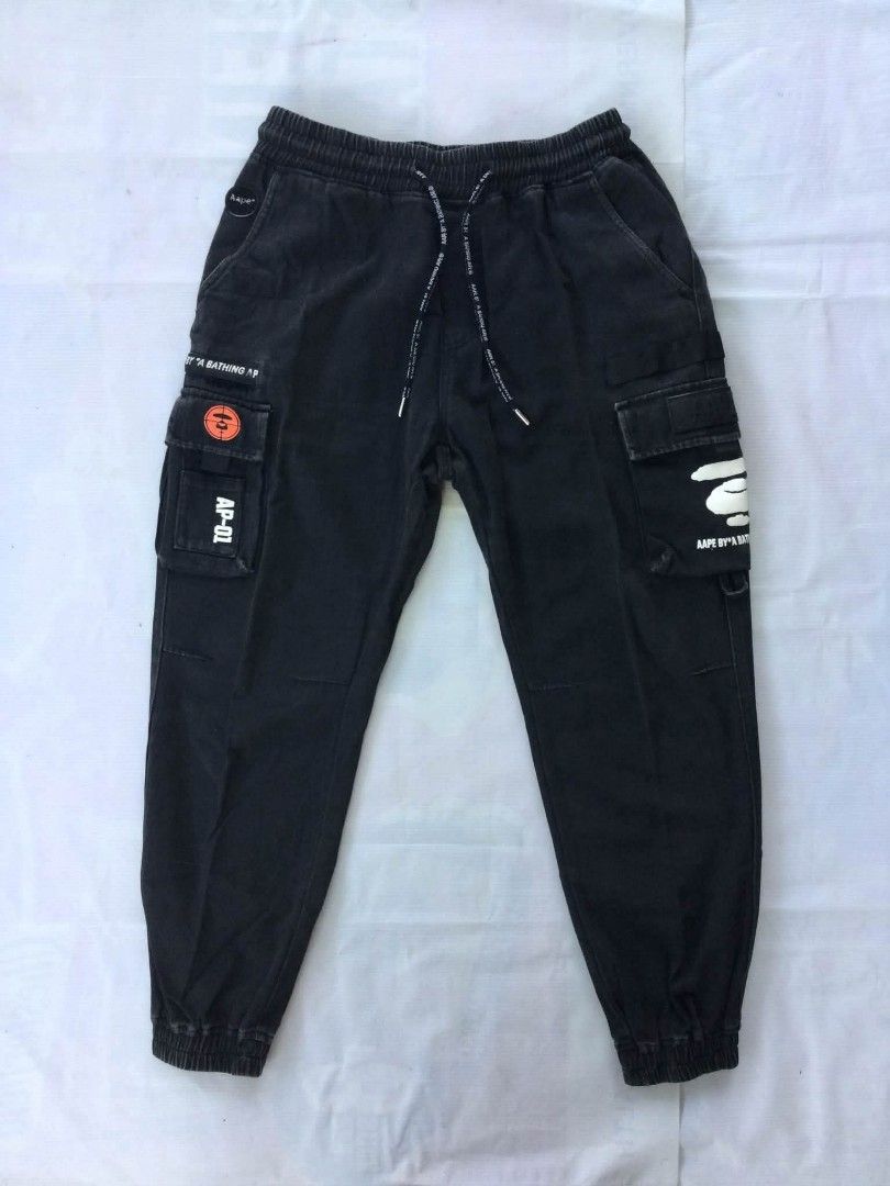 Aape By A Bathing Ape Multi-Pocket Utility Cargo Jogger Pants (Category: Jeans) located in Caloocan City. Submitted by babradede215 (Listing ID 1459023487, Image 1). Description: Waistline : 28 to 32 Length : 38 Hem : 6 to 7 Color Rate : 9.8/10.