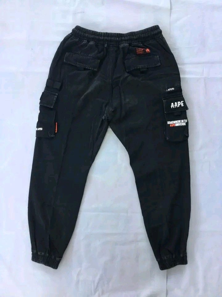 Aape By A Bathing Ape Multi-Pocket Utility Cargo Jogger Pants (Category: Jeans) located in Caloocan City. Submitted by babradede215 (Listing ID 1459023487, Image 2). Description: Waistline : 28 to 32 Length : 38 Hem : 6 to 7 Color Rate : 9.8/10.