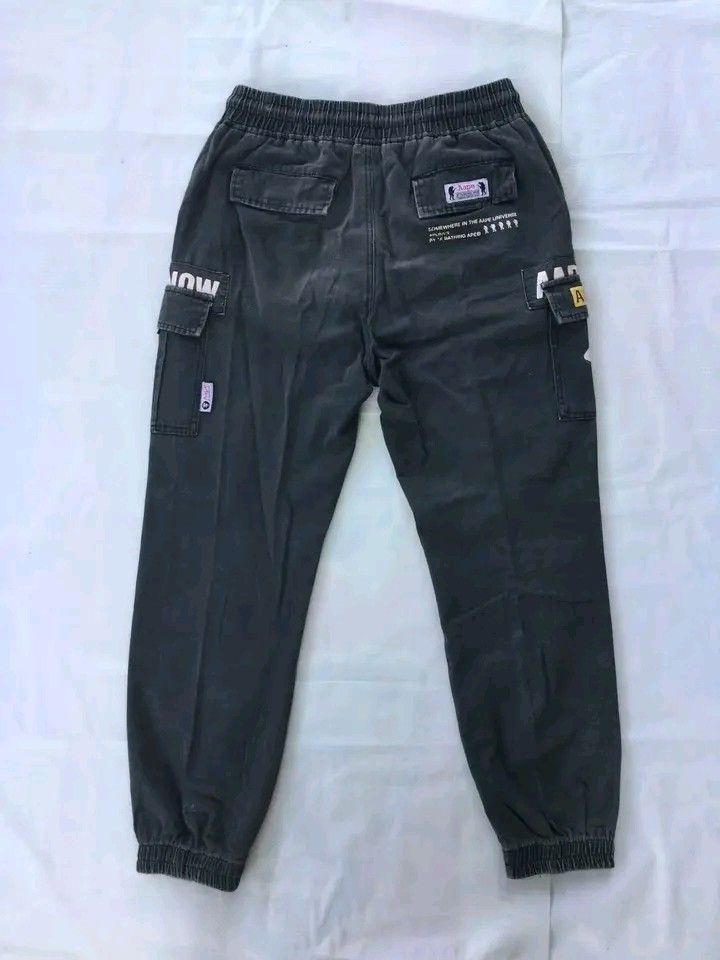 Aape By A Bathing Ape Multi-Pocket Utility Cargo Jogger Pants (Category: Jeans) located in Caloocan City. Submitted by babradede215 (Listing ID 1459024732, Image 2). Description: Waistline : 29 to 34 Length : 38 Hem : 6 to 8 Color Rate : 9.5/10 Has Issues .