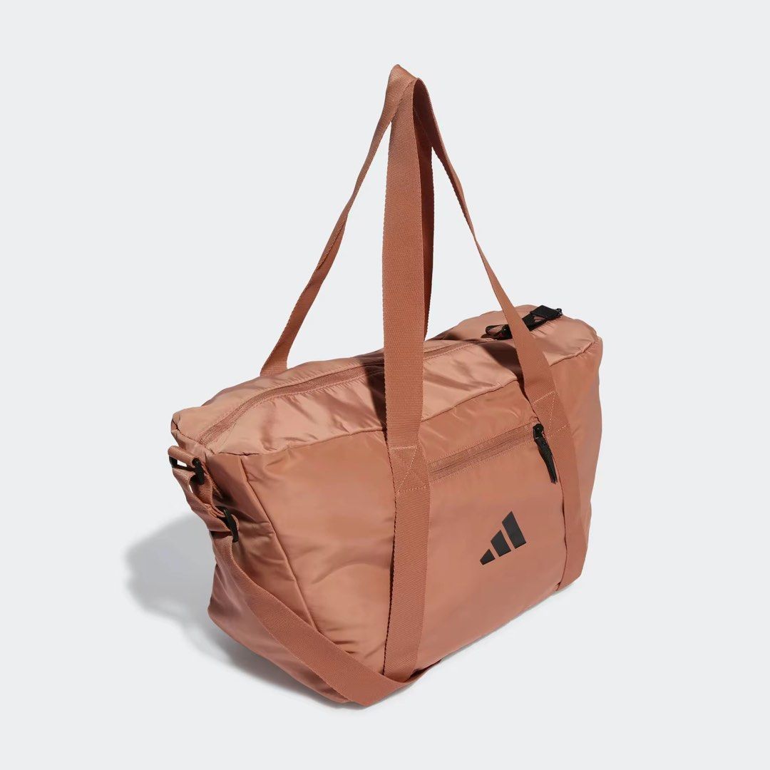 Adidas Gym Bag (Brown) (Category: Tote Bags) located in Cebu City. Submitted by jazziejazz (Listing ID 1458991741, Image 3). Description: - Dual carry handles - Volume: 30.5 L - Dimensions: 23 cm x 54 cm x 27 cm - 100% polyester (recycled) - Adjustable shoulder strap - Interior pockets and inner shoe compartment - Front zip pocket 📍 Iloilo City.