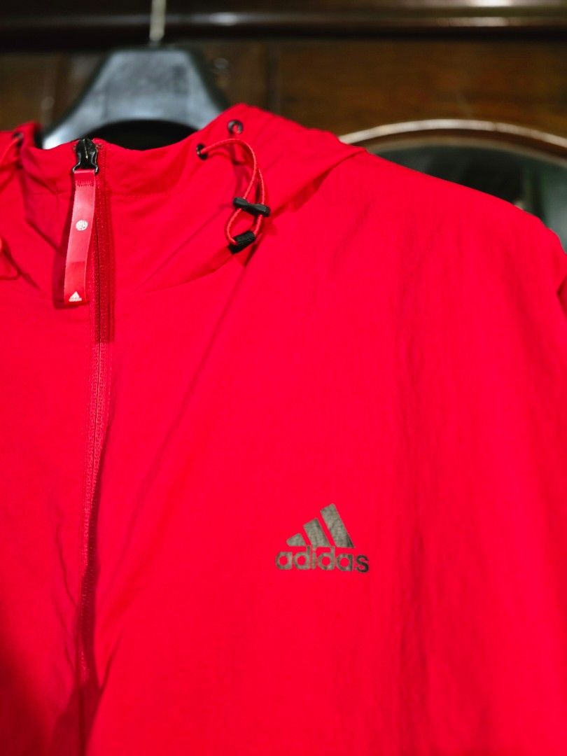 Adidas Red Jacket with Chinese New Year Graphics (Category: Coats, Jackets and Outerwear) located in Baguio. Submitted by genesisomega (Listing ID 1458966358, Image 1). Description: - Vibrant bright red Adidas jacket - Unique Chinese New Year graphic design on pockets - Classic Adidas logo on the chest - Adjustable drawstrings on hood and hem - Full zipper closure - Dimes 27 x 32 - Ideal for everyday casual wear ✨ PLEASE READ BEFORE BUYING! ✨ 👕 