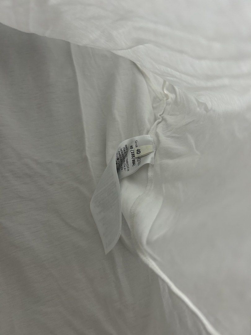Alexander McQueen White Graphic T-Shirt (Category: Luxury Apparel) located in Tacloban City. Submitted by houseofluxury.co (Listing ID 1458931741, Image 3). Description: - Authentic Alexander McQueen white t-shirt - Features iconic 'McQueen' graphic print - Includes 'Alexander McQueen Est. 1992' text - Made in Italy - Crafted from comfortable cotton material - Ideal for everyday casual wear.