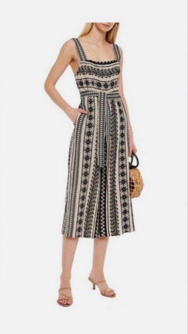 Alice + Olivia Black & White Patterned Jumpsuit Size 2 (Category: Jumpsuits) located in Makati City. Submitted by bibas.corner (Listing ID 1459045764, Image 1). Description: - Alice + Olivia jumpsuit - Black and white geometric pattern - Square neckline with lace trim - Belted waist - Wide leg cropped pants - Side pockets - Ideal for day outs or casual events - Comfortable and stylish.