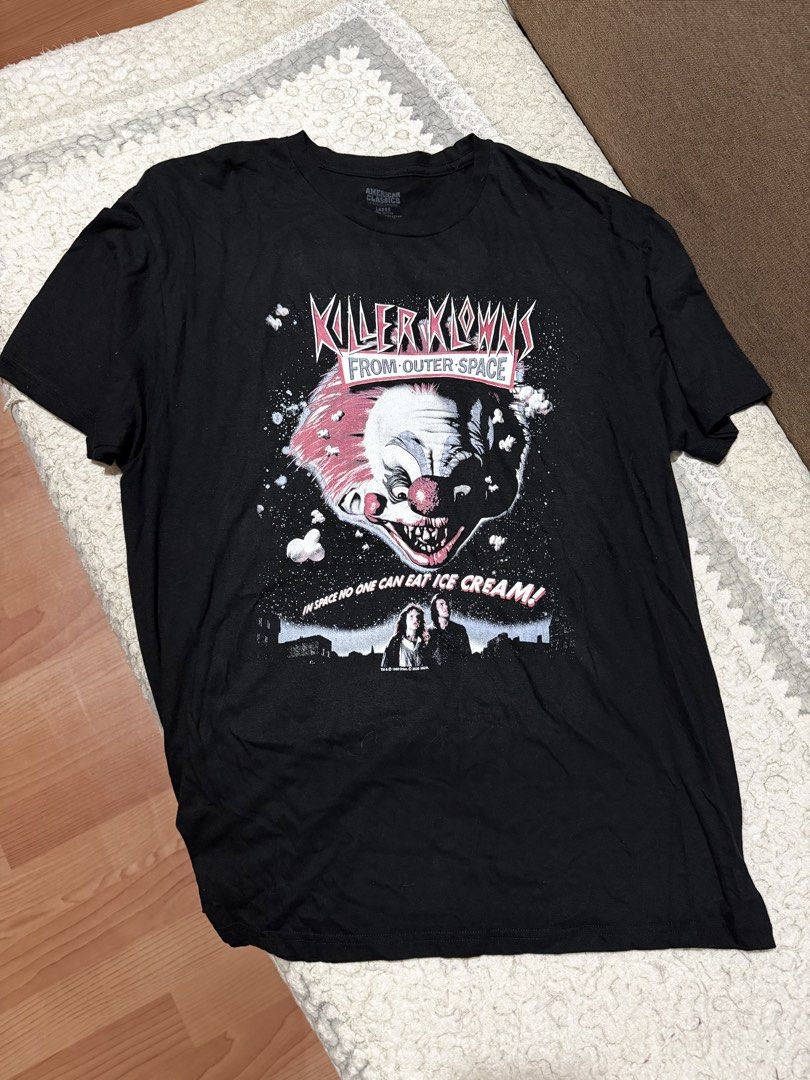 American Classics Killer Klowns From Outer Space T-Shirt Large (Category: Tshirts & Polo Shirts ) located in Baguio. Submitted by shadaxcel (Listing ID 1459045257, Image 1). Description: - Black t-shirt featuring Killer Klowns From Outer Space graphic - Iconic clown design with the quote 'In Space No One Can Eat Ice Cream' - Officially licensed apparel from American Classics - Made from 100% comfortable cotton - Tagged as size Large - Ideal for f