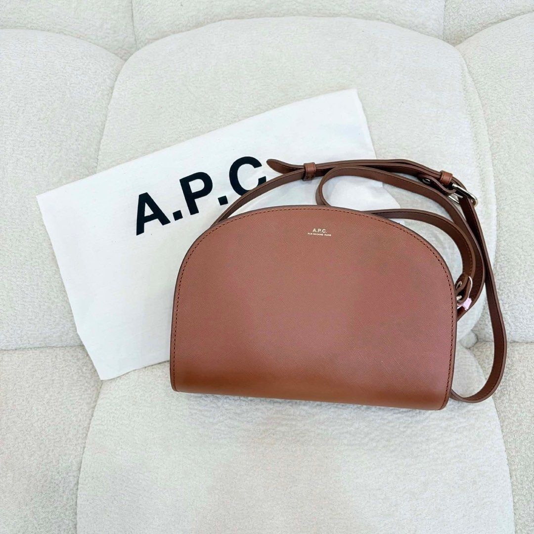 A.P.C. Half Moon Bag Brown Leather (Category: Cross-body Bags) located in San Leonardo. Submitted by iluvkopiii (Listing ID 1458922287, Image 1). Description: A.P.C. Demi-Lune Hazelnut Hobo Crossbody A timeless everyday luxury piece crafted in rich hazelnut leather, featuring A.P.C.'s iconic minimalist silhouette. Elegant, versatile, and easy to style for any occasion. Minimal sign of usage only ₱8,500 only (saw it in Japan outlet for ₱22K 🙊).