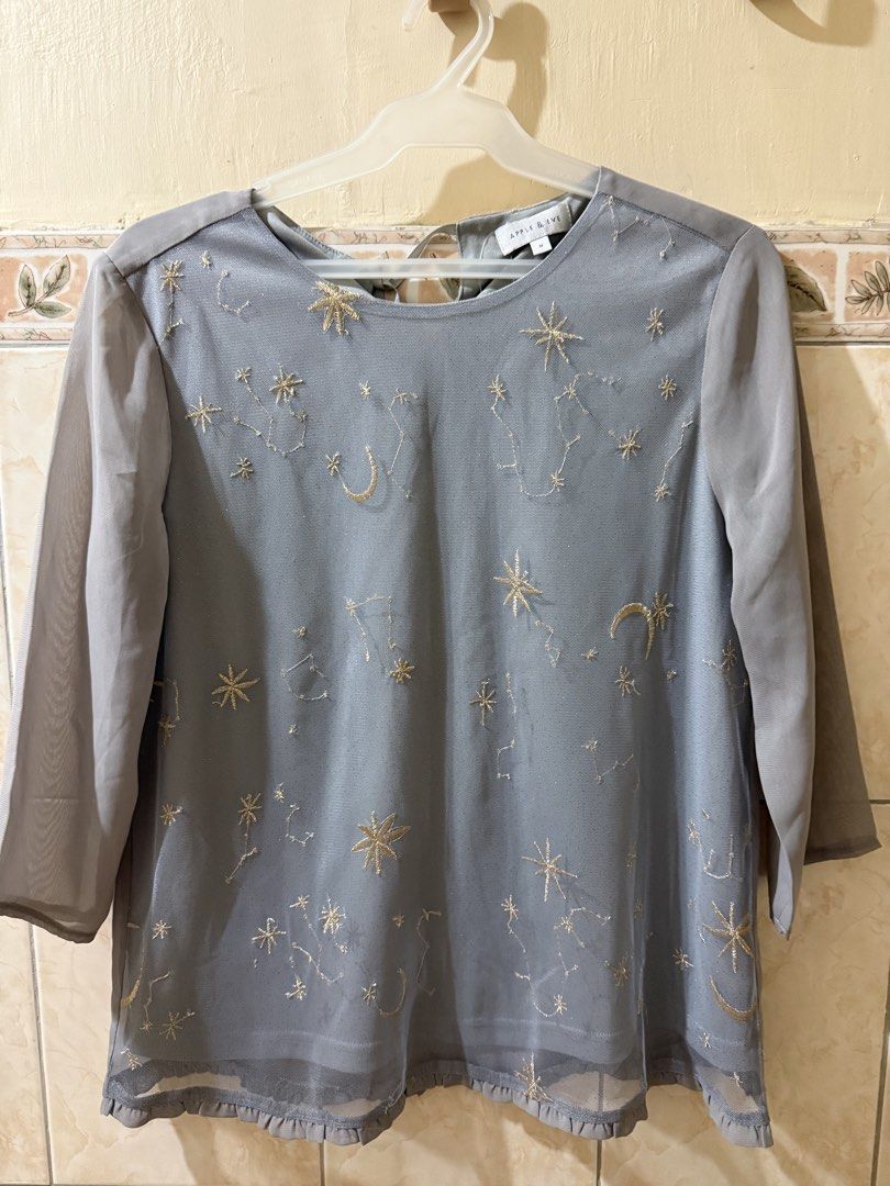 BRAND NEW Apple & Eve Gray Celestial Constellation Mesh Blouse Medium (Category: Blouses) located in Manila. Submitted by fashfab (Listing ID 1458904910, Image 1). Description: - Gray mesh blouse - Features celestial constellation embroidery - 3/4 sleeves - Ruffled hem - Tie detail at the back - Brand new with original tag attached - Original price: P1499.75.