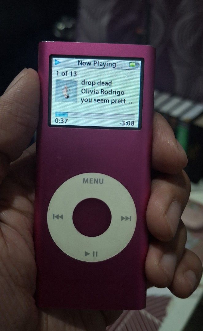 Apple iPod Nano 2nd Gen 4GB Pink (Category: Portable Music Players) located in Manila. Submitted by janeeyren (Listing ID 1458912197, Image 3). Description: Kindly READ before chatting: - Tested and working without issues - Comes with a blue case and charging cable - Battery has been replaced - Screen has no issue when being used but if you tilt the device at a certain angle, there is a scratch (unnoticeable) - Clickwheel has no issue as well - C