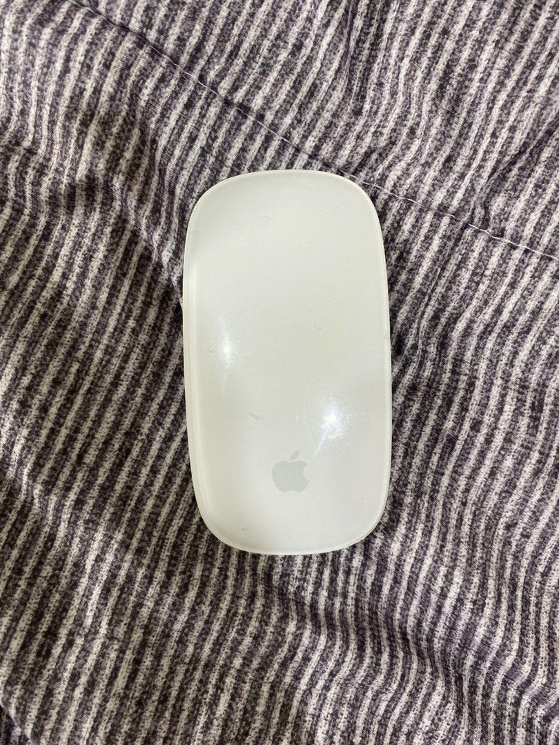 Apple Magic Mouse (Category: Mouse & Mousepads) located in Kuala Lumpur. Submitted by il4veme99082 (Listing ID 1458947950, Image 1). Description: - Apple Magic Mouse - Wireless connectivity - Smooth scrolling and multi-touch surface - Works great - Minor scuffs on casing from normal use - Plenty of life left.