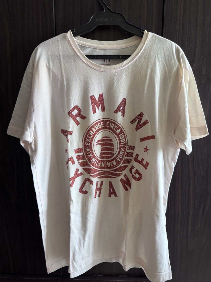 Armani Exchange Graphic T-Shirt (Category: Tshirts & Polo Shirts ) located in Manila. Submitted by enzomagbat44789 (Listing ID 1458989279, Image 1). Description: XL | 21x27 Preloved | Not Ukay 8/10 Condition Issue: yellow stains (washable) Shipping via JnT / LBC (COD).