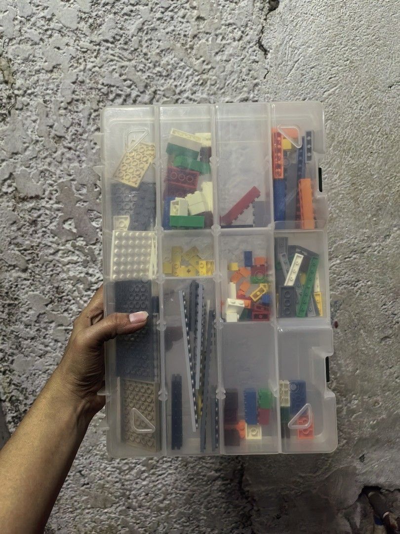 Assorted Lego Bricks in Storage Container (Category: Lego & Building Sets) located in Paranaque City. Submitted by furugiyafinds (Listing ID 1458900694, Image 2). Description: - Assorted Lego bricks - Various colors and sizes - Includes clear plastic storage container with multiple compartments - Ideal for building and creative play - Plenty of pieces for hours of fun.