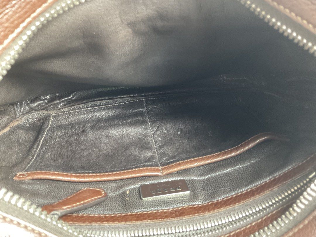 Auth Prada men’s bag (Category: Luxury Bags & Wallets) located in Caloocan City. Submitted by siftedthriftedph (Listing ID 1458945053, Image 3). Description: P.R.A.D.A Men Vitello Daino | Caffe + Caramel - This Prada men’s sling bag is crafted from the signature luxury leather, Vitello Daino in a two-tone caffe and caramel colorway. - Structured yet slouchy messenger style with an adjustable leather shoulder strap. - Large front zippered pocket f