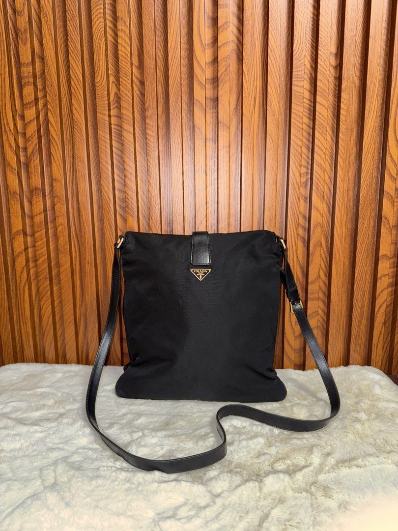 Authentic Prada Black Nylon Leather Shoulder Bag (Category: Luxury Bags & Wallets) located in Subic. Submitted by luxshoppe88 (Listing ID 1458921265, Image 1). Description: - Authentic Prada shoulder crossbody bag - Color: Black nylon with leather trim - Hardware: Gold details - Interior: Zip pocket - Condition: Clean inside and out - Origin: Made in Italy - Style: Great everyday bag mode of payment : bpi and gcash shipping will be done once paym