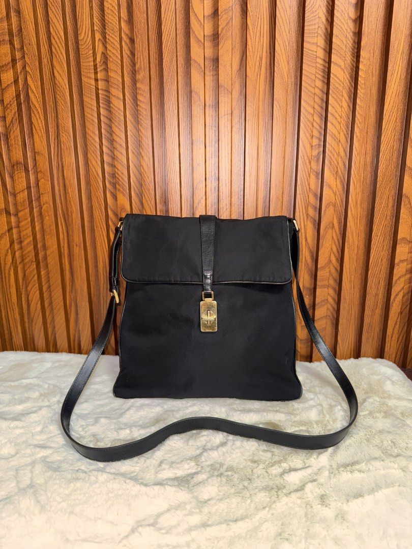Authentic Prada Black Nylon Leather Shoulder Bag (Category: Luxury Bags & Wallets) located in Subic. Submitted by luxshoppe88 (Listing ID 1458921265, Image 2). Description: - Authentic Prada shoulder crossbody bag - Color: Black nylon with leather trim - Hardware: Gold details - Interior: Zip pocket - Condition: Clean inside and out - Origin: Made in Italy - Style: Great everyday bag mode of payment : bpi and gcash shipping will be done once paym