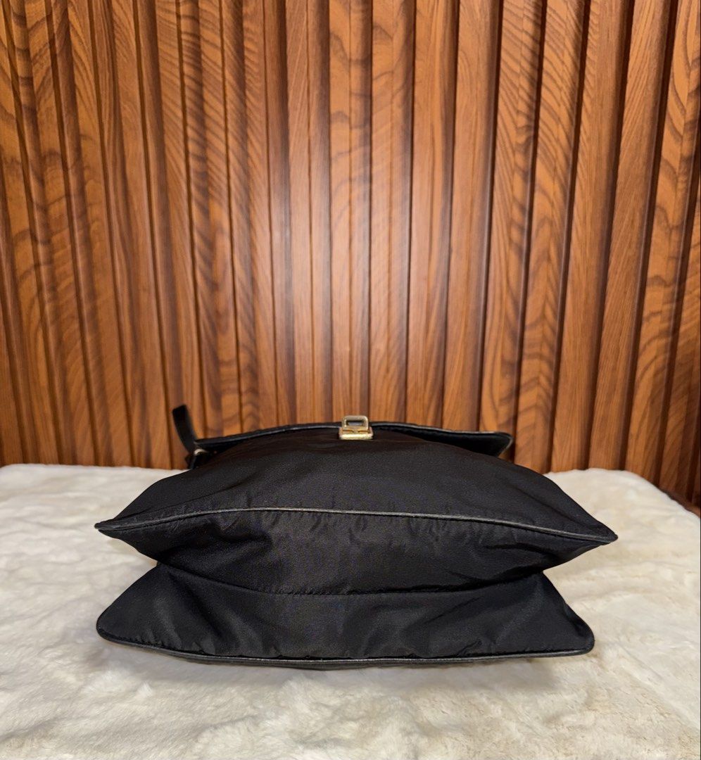 Authentic Prada Black Nylon Leather Shoulder Bag (Category: Luxury Bags & Wallets) located in Subic. Submitted by luxshoppe88 (Listing ID 1458921265, Image 3). Description: - Authentic Prada shoulder crossbody bag - Color: Black nylon with leather trim - Hardware: Gold details - Interior: Zip pocket - Condition: Clean inside and out - Origin: Made in Italy - Style: Great everyday bag mode of payment : bpi and gcash shipping will be done once paym
