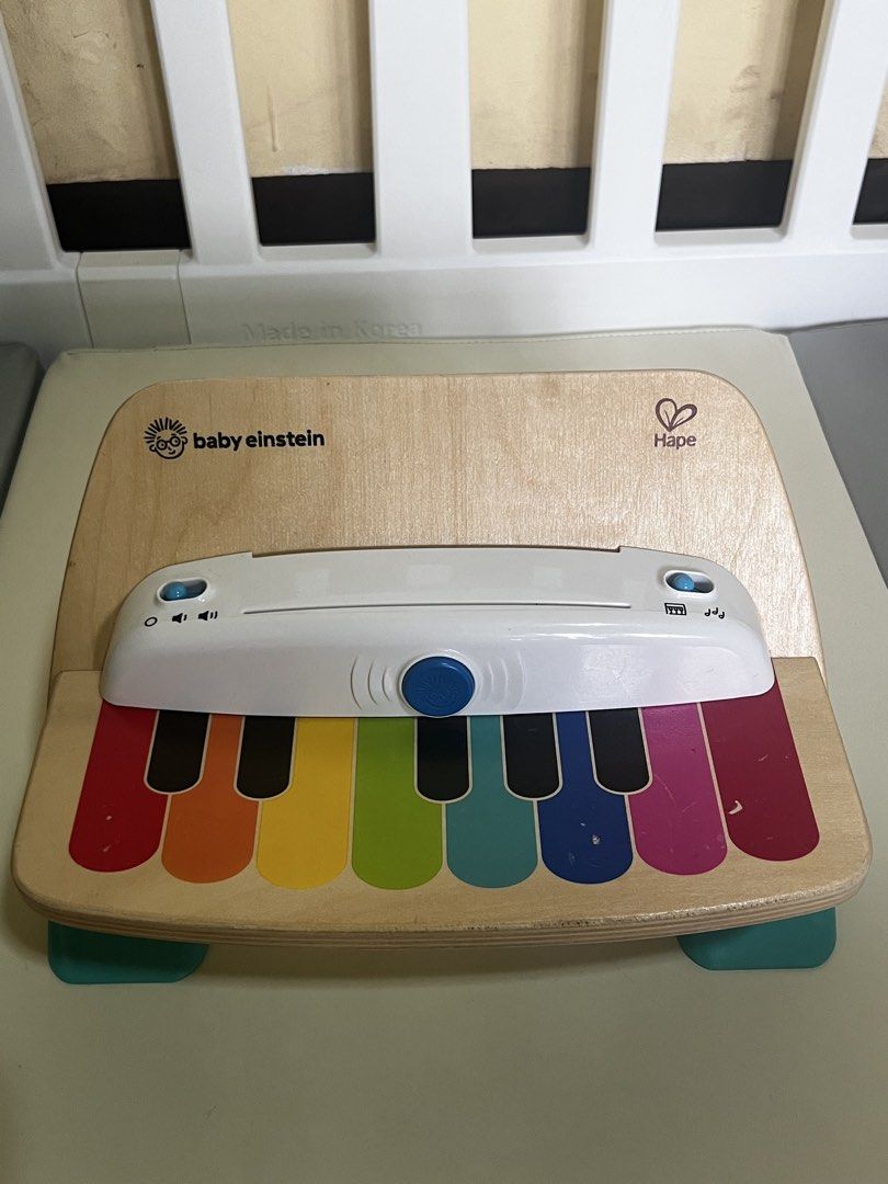 Baby Einstein and Hape Magic Touch Piano (Category: Infant Playtime) located in Angono. Submitted by elyenitty_ (Listing ID 1458925793, Image 1). Description: Key Features - Magic Touch Technology: The wooden keys respond to a light touch without needing traditional buttons or pressed keys. - Color-Coded Keys: Features bright, painted colors to help young children learn colors and match notes. - Sound Control: Includes power and volume buttons on