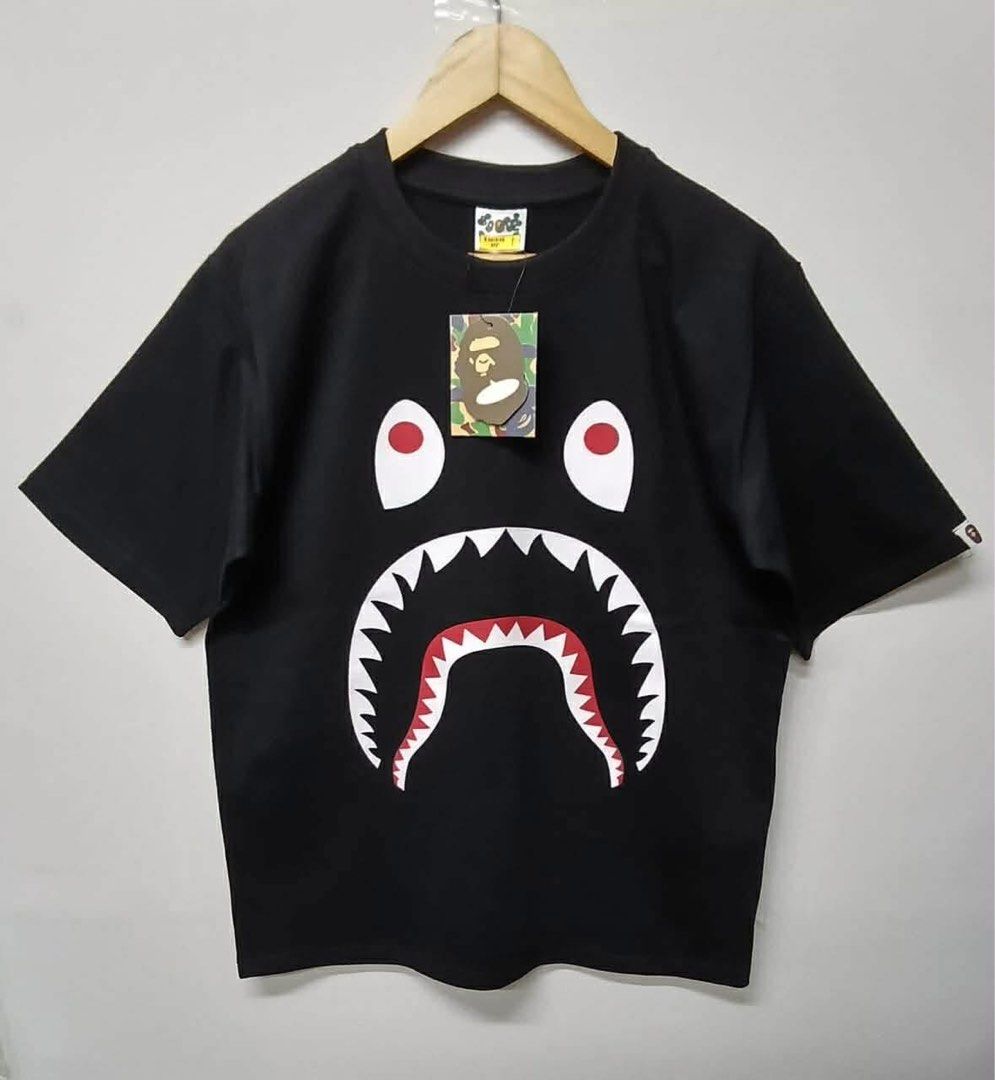 BAPE Shark Tee Black (Category: Tshirts & Polo Shirts ) located in Manila. Submitted by vintaurafindsco. (Listing ID 1458938455, Image 1). Description: - Classic BAPE Shark Graphic Tee - Color: Black - Features the iconic shark face design - Comes with original tags - Perfect for streetwear enthusiasts - Don't miss this popular design!.