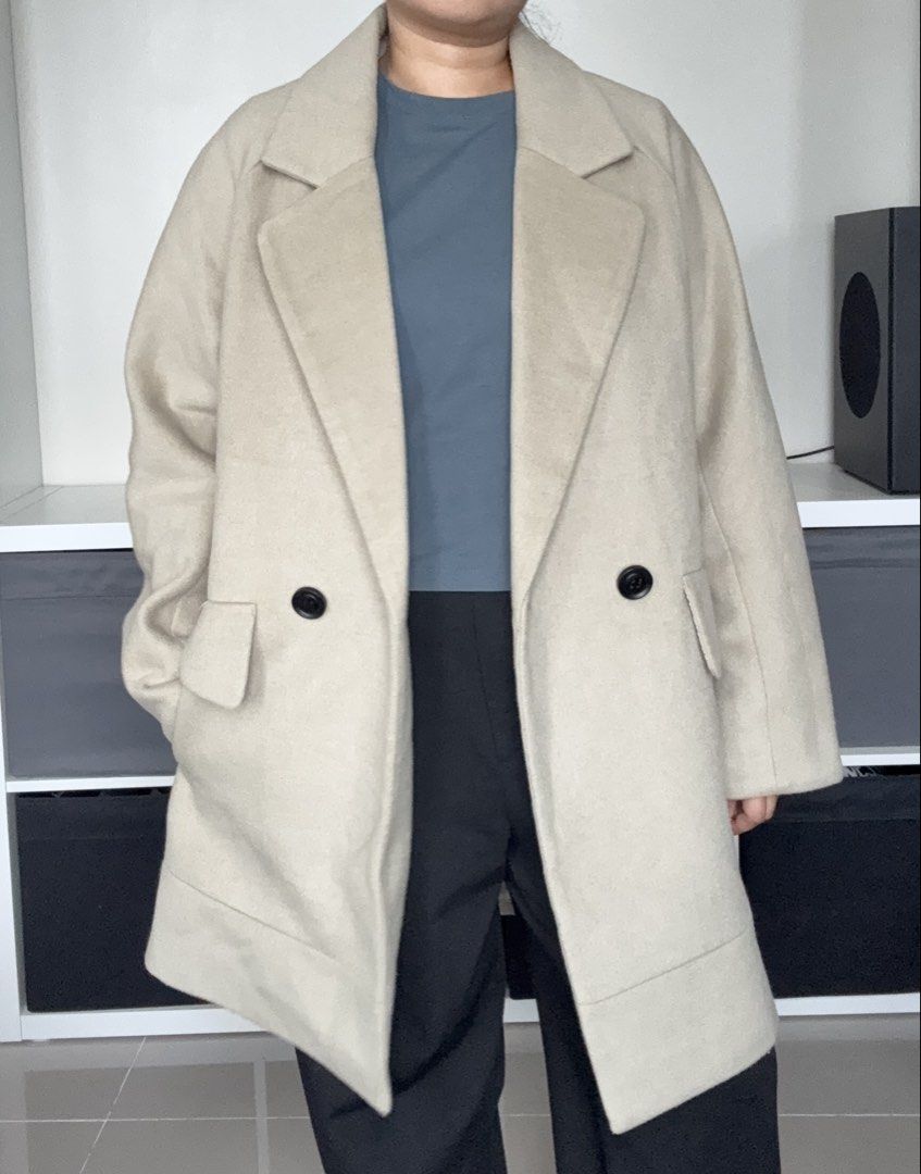 Beige Wool Blend Double Breasted Coat Size Large with full inner lining (Category: Coats, Jackets and Outerwear) located in Quezon City. Submitted by springdreamph (Listing ID 1459025602, Image 2). Description: - Beige (green undertone) double-breasted coat - Brand: TOPFEELING - Material: Wool blend polyester fabric - Full inner lining - Features: Two front pockets, button closure - Thick fabric - Ideal for: 10 degrees and below - Styling: Versat