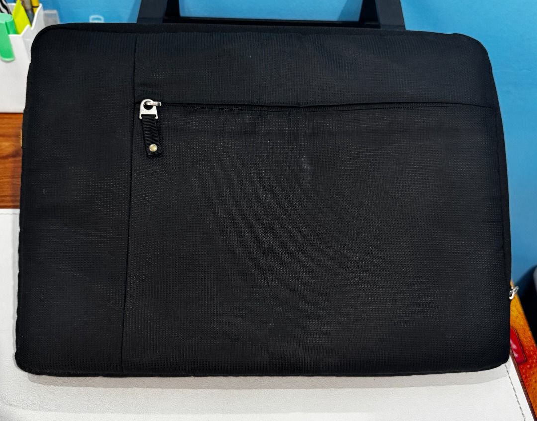 Black Laptop Bag 14-inch (CASE LOGIC) (Category: Laptop Bags & Sleeves) located in Quezon City. Submitted by eonnnnn (Listing ID 1458911085, Image 1). Description: - Durable black laptop bag - Front zip pocket for easy access - Measures 14 inches across - Ideal for carrying your laptop and daily essentials - Ready for a new owner!.