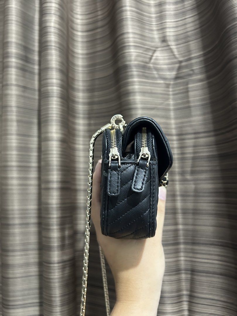 Black Quilted Chevron Shoulder Bag with Snake Clasp (Category: Luxury Bags & Wallets) located in Tacloban City. Submitted by houseofluxury.co (Listing ID 1458932859, Image 2). Description: - Authentic Bvlgari Black quilted shoulder bag - Elegant chevron pattern - Gold chain strap - Unique snake head clasp closure - Two zippered side compartments - Ideal for carrying daily essentials.