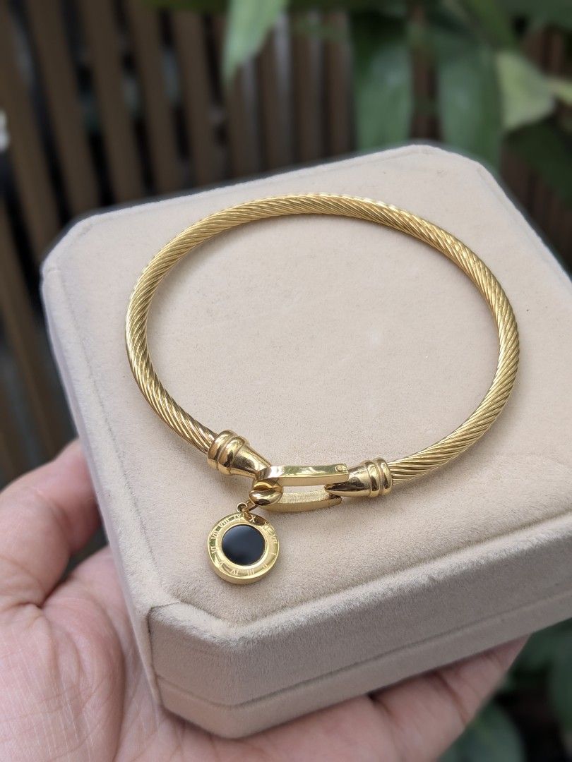 Black Stone Full Gold Tone Bangle Bracelet (Category: Bracelets) located in Quezon City. Submitted by nnncorner (Listing ID 1459023859, Image 2). Description: BKK Black Stone Full Gold Tone Roman Numerals Bangle New with box Hypoallergenic Non tarnished Super pretty and nice in person Fits 15-20cm wrist only 890.