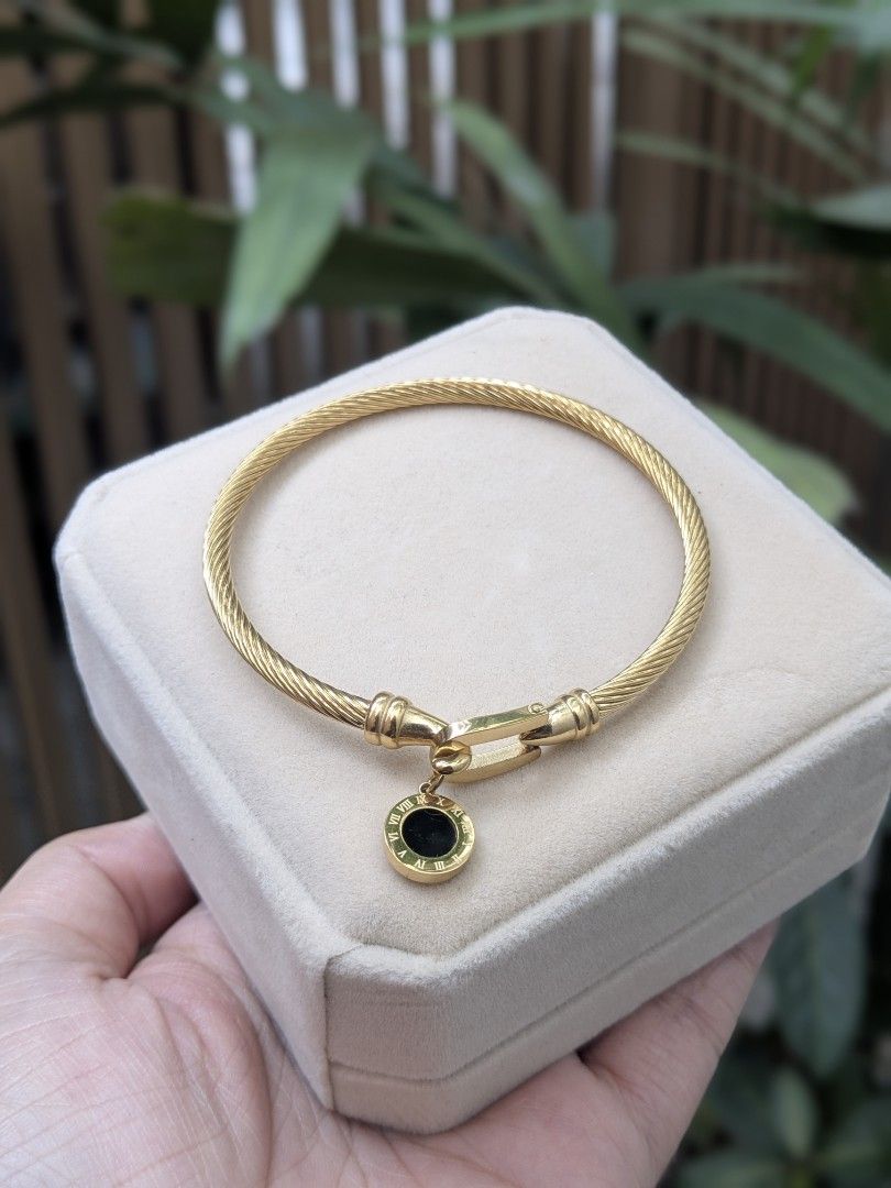 Black Stone Full Gold Tone Bangle Bracelet (Category: Bracelets) located in Quezon City. Submitted by nnncorner (Listing ID 1459023859, Image 1). Description: BKK Black Stone Full Gold Tone Roman Numerals Bangle New with box Hypoallergenic Non tarnished Super pretty and nice in person Fits 15-20cm wrist only 890.