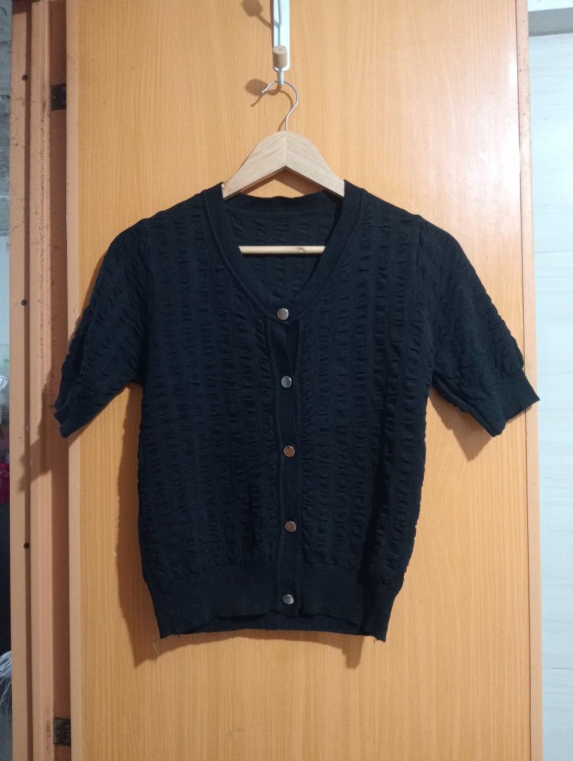 Black Textured Button-Up Short Sleeve Cardigan (Category: Coats, Jackets and Outerwear) located in Quezon City. Submitted by niceoutfits (Listing ID 1459056328, Image 2). Description: - Cute black cardigan with a textured pattern. - Size : Small to Medium - LP Posted - Dimes : 17x 21 inches ( relax measurements ) - Soft Thick Fabric Knitted Pattern Details - Short sleeves and button-up front. - Great for layering over tops or wearing on its own. 