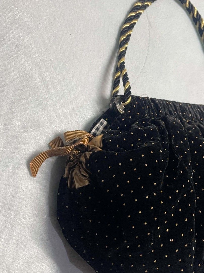 Black Velvet Beaded Drawstring Handbag with Gold Rope Handle (Category: Purses & Pouches) located in Binan City. Submitted by myks_thrift (Listing ID 1458966839, Image 3). Description: - Chic black velvet handbag with charming gold polka dots. - Elegant beaded lace detail on the front flap. - Stylish gold rope handle for comfortable carrying. - Secure drawstring closure with decorative gold ribbon ties. - Compact size, ideal as a clutch or evenin