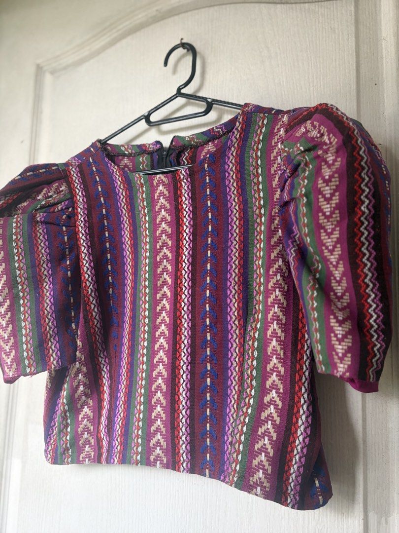 Boho Puff Sleeve Blouse with Geometric Print (Category: Blouses) located in Cavite. Submitted by drappinmonica (Listing ID 1458899027, Image 2). Description: - Funky puff sleeve top - Vibrant geometric print - Rich colors: purple, red, green, and blue - Short, puffy sleeves - Zipper closure at the back - Makes a great statement piece.