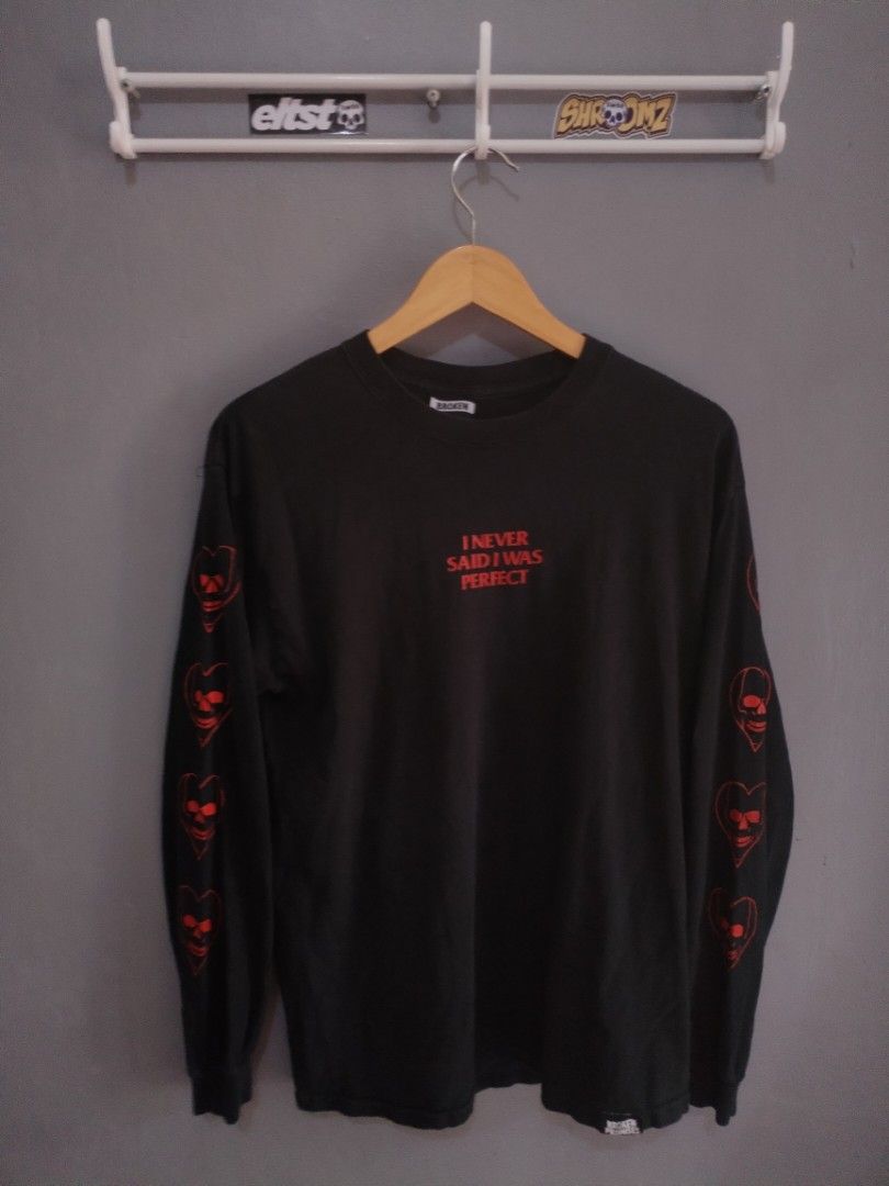 Broken Promises "Long Sleeve( designed in Los Angeles) (Category: Tshirts & Polo Shirts ) located in Naga. Submitted by basejohnpa64527 (Listing ID 1452600154, Image 1). Description: - Brand: Broken Promises - Color: Black - Style: Long sleeve t-shirt - Size: Medium (M) -Made in Los Angeles - Front Graphic: "I NEVER SAID I WAS PERFECT" in red text - Sleeve Graphics: Red skull and heart design on both sleeves - Origin: Made in Mexico Designed in L