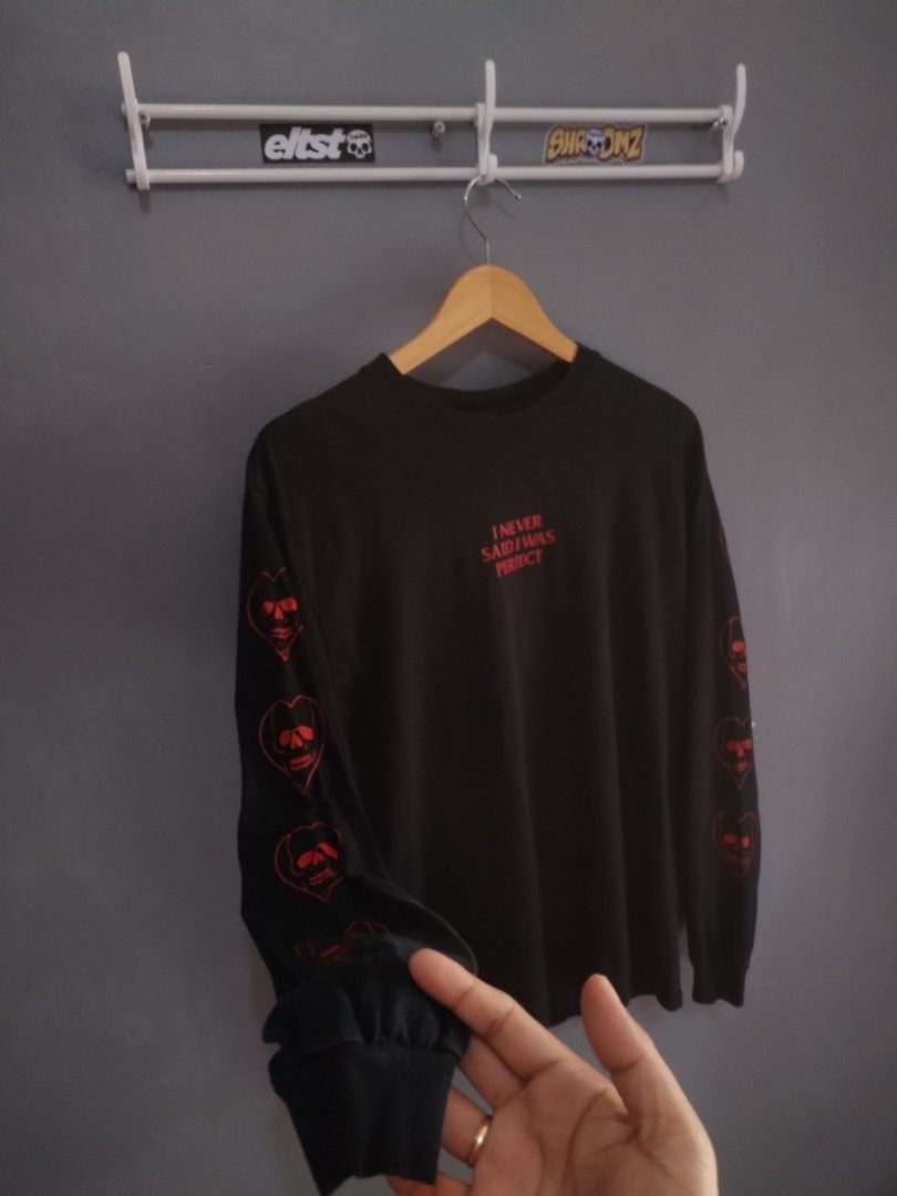 Broken Promises "Long Sleeve( designed in Los Angeles) (Category: Tshirts & Polo Shirts ) located in Naga. Submitted by basejohnpa64527 (Listing ID 1452600154, Image 2). Description: - Brand: Broken Promises - Color: Black - Style: Long sleeve t-shirt - Size: Medium (M) -Made in Los Angeles - Front Graphic: "I NEVER SAID I WAS PERFECT" in red text - Sleeve Graphics: Red skull and heart design on both sleeves - Origin: Made in Mexico Designed in L