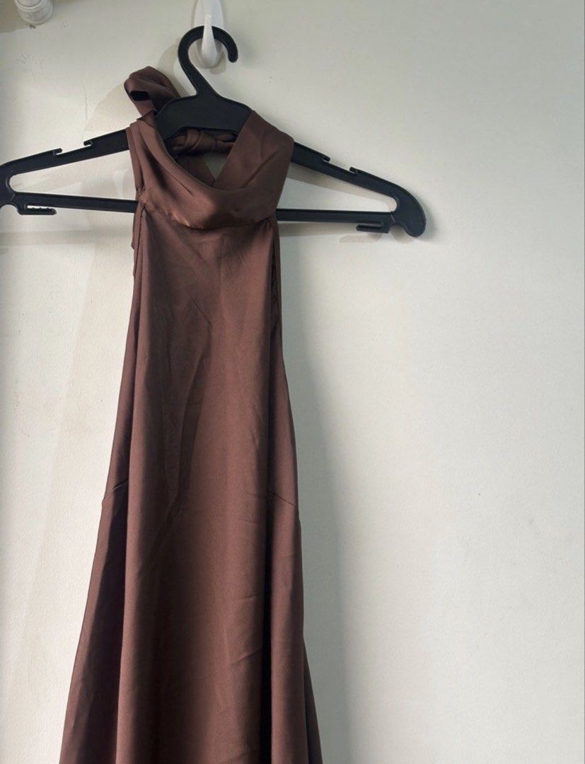 Brown Halter Neck Maxi Dress (Category: Dresses) located in Cavite. Submitted by drappinmonica (Listing ID 1458898205, Image 3). Description: - Brown halter neck maxi dress - Made of satin material - Ties at the back of the neck - Features a flowy skirt - Ideal for events or a night out - Fits true to size.