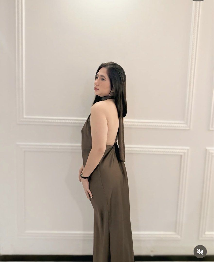 Brown Halter Neck Maxi Dress (Category: Dresses) located in Cavite. Submitted by drappinmonica (Listing ID 1458898205, Image 2). Description: - Brown halter neck maxi dress - Made of satin material - Ties at the back of the neck - Features a flowy skirt - Ideal for events or a night out - Fits true to size.