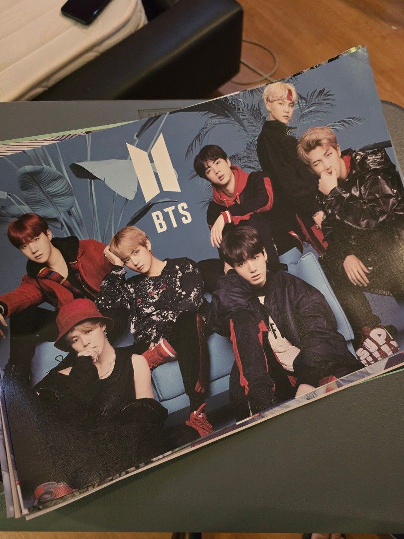 BTS Kpop Group Poster (Category: K-Wave Merchandise) located in Quezon City. Submitted by fmclopez (Listing ID 1458961924, Image 1). Description: - BTS group poster - Features all members in a group shot - Iconic BTS logo prominently displayed - Casual wear with a tropical background - Ideal size for framing or wall display - A must-have collectible for any ARMY.