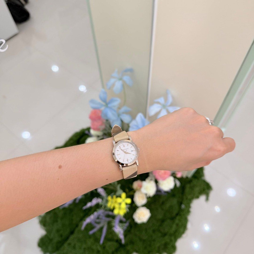 Burberry Watch with Classic Check Strap (Category: Luxury Watches) located in San Leonardo. Submitted by iluvkopiii (Listing ID 1458922833, Image 3). Description: Burberry Swiss Made Quartz Watch featuring the iconic Nova Check textile strap and a classic silver dial. Complete with original box and authenticity card. ₱15,000 only.