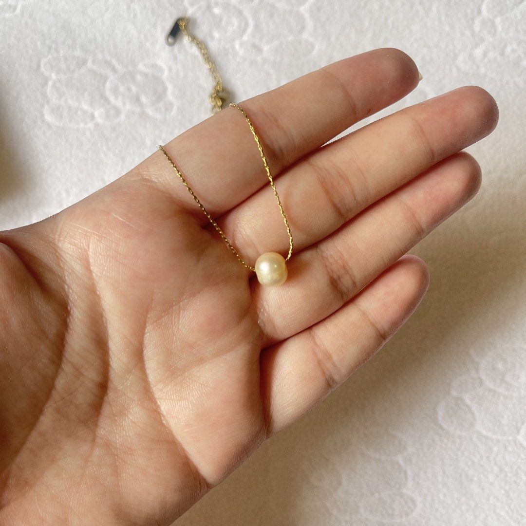 Burvon Pearl Collection Necklace (Isla) (Category: Body Jewelry) located in Bulacan. Submitted by koolkart (Listing ID 1458937737, Image 3). Description: product description - chain type: box - measurement (cm): 40.5 (0.5 x 2.5) - color: gold - original price: 760 - used for several times, then stored on a jewelry case - flaws: the pearl has scratches - with box - box is supposedly for rings hence the size, but still a good fit to store the neckl