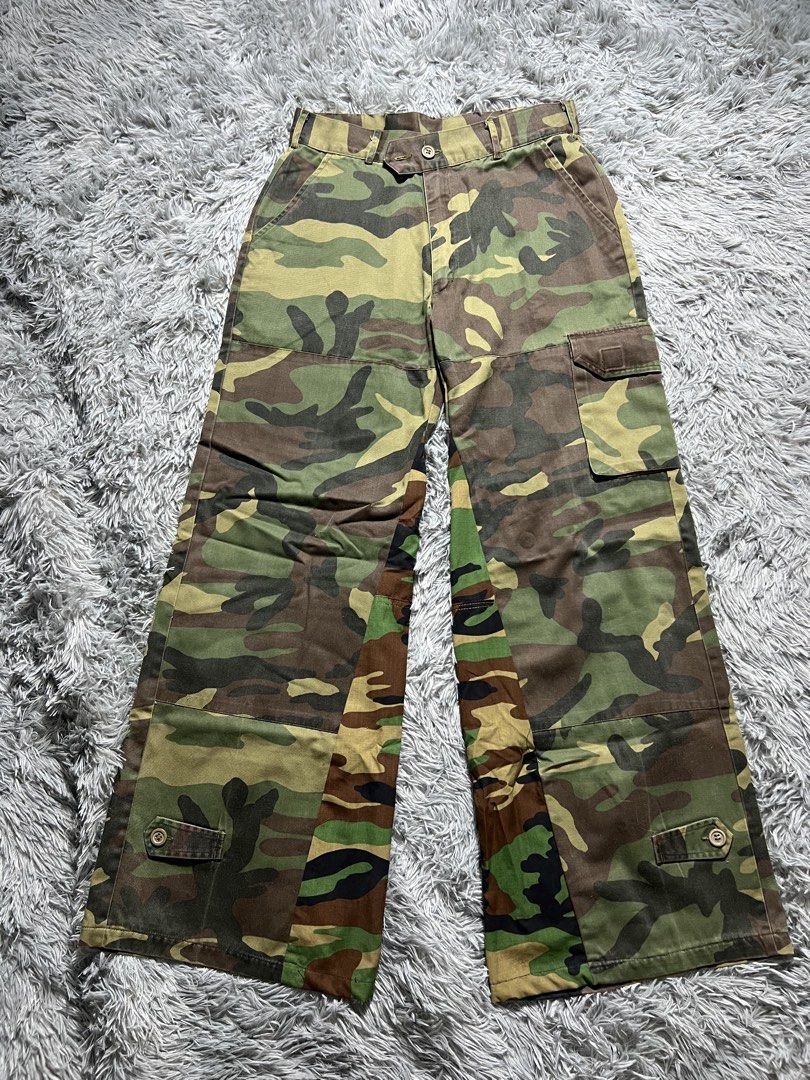 Camo Baggy Wide Leg Cargo Pants (Category: Jeans) located in Naga. Submitted by eighttttt (Listing ID 1458919504, Image 1). Description: - Unique camo patchwork design - Wide leg, cargo style - Button and zip front closure - Front and back pockets - Side cargo pockets - Perfect for a statement outfit.