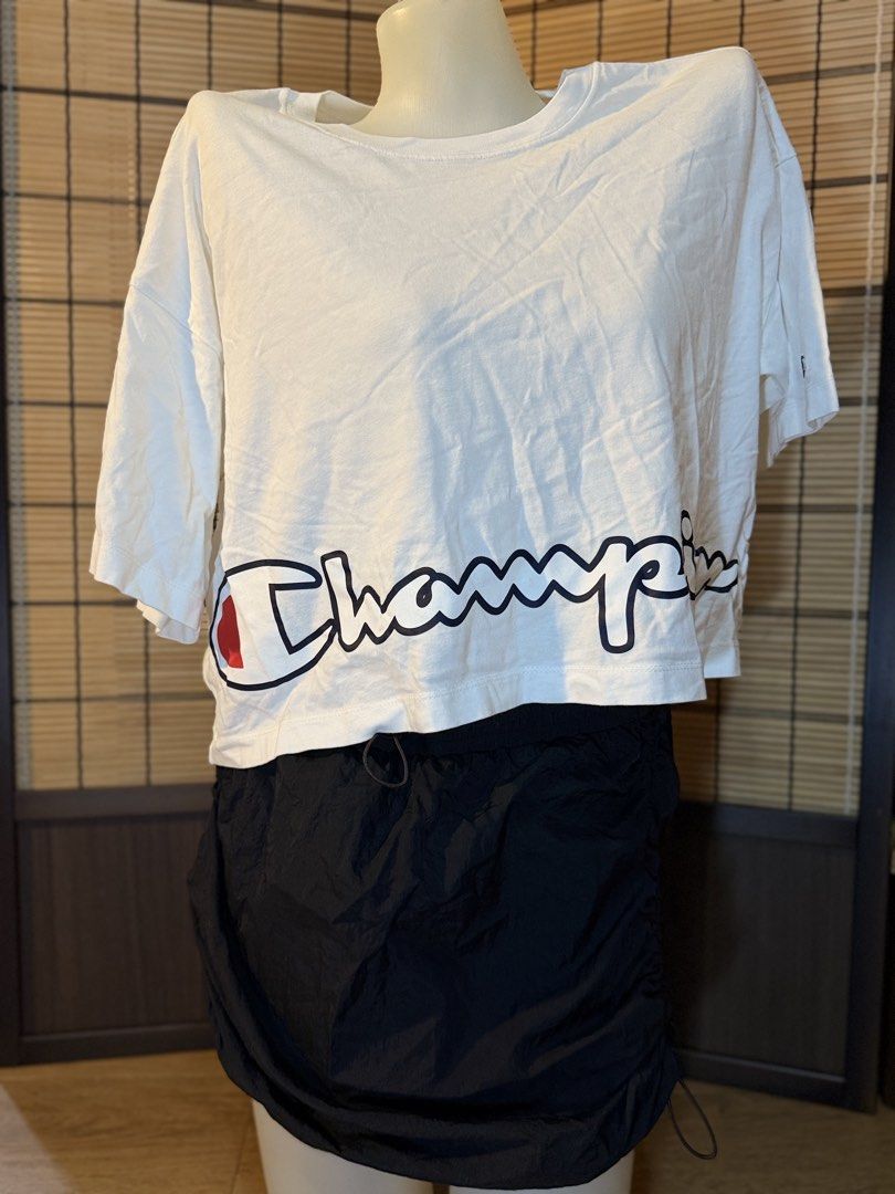 Champion White Cropped T-Shirt Size Small (Category: Shirts) located in Subic. Submitted by xzikyra (Listing ID 1458905385, Image 1). Description: - White Champion cropped t-shirt - Classic Champion logo on front - Size: Small - Made in Cambodia - Ideal for casual wear or layering - Pairs well with shorts or jeans.