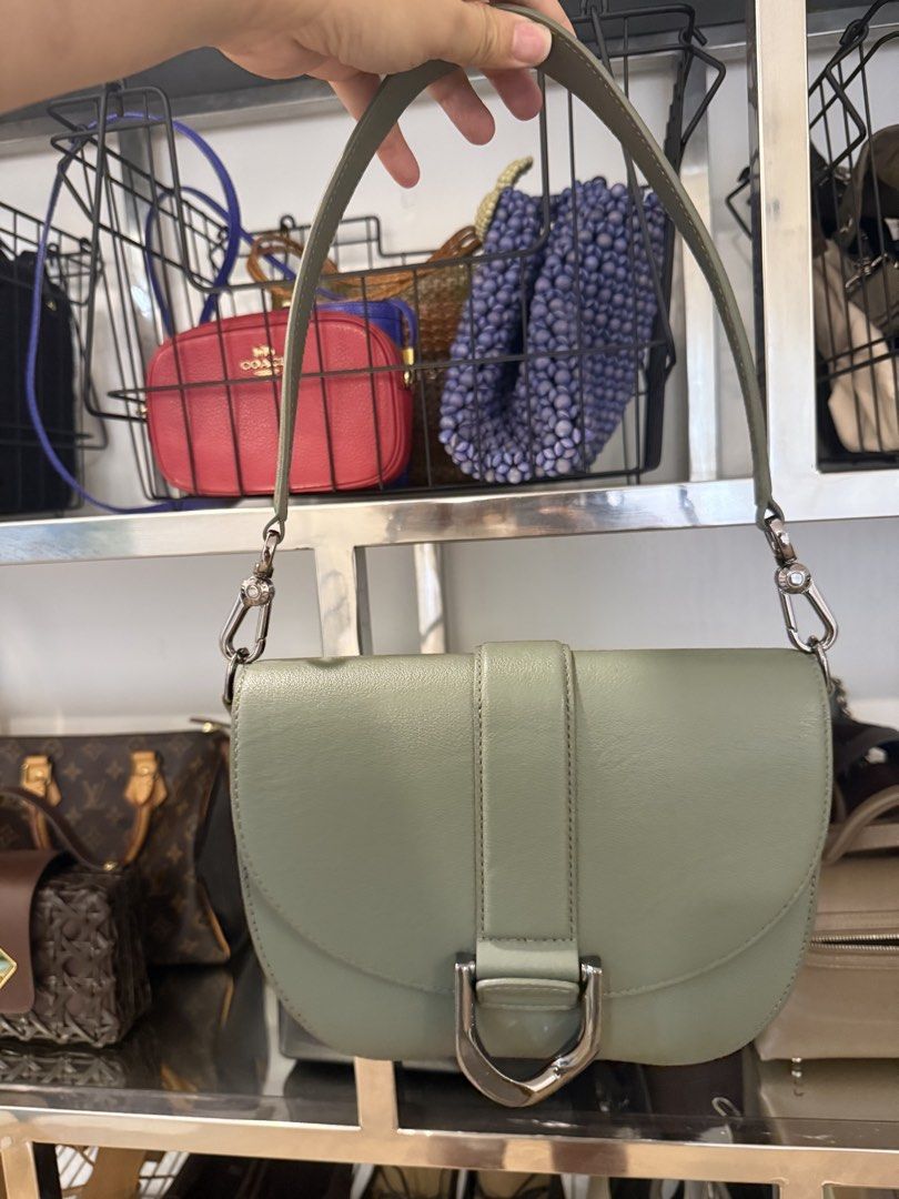 Genuine Leather Gabine Shoulder Bag (Category: Shoulder Bags) located in San Juan City. Submitted by dyclutter (Listing ID 1458913860, Image 1). Description: - Authentic (SRP php 8,500) Model: Gabine Genuine Leather Sage green shoulder bag Comes with a long strap also - Chic half-moon silhouette - Front flap with elegant buckle detail - Polished silver hardware - Interior zip pocket for essentials - Adjustable strap for comfortable wear - Ideal f