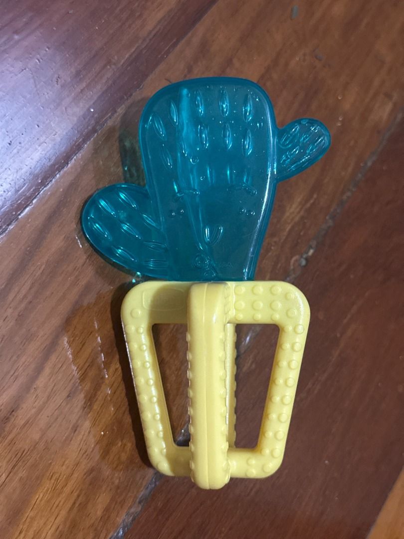 Chicco Newborn Refreshing Cooling Baby Teether, Design: Cactus (Category: Infant Playtime) located in Makati City. Submitted by travelfinds34611 (Listing ID 1458976045, Image 2). Description: GREAT CONDITION. USED 1-2x ONLY Chicco Newborn Refreshing Cooling Baby Teether, Design: Cactus - Cooling cactus teether for babies - Water-filled for refreshing relief - Multiple textures to soothe sore gums - Easy for little hands to grasp - Helps ease teet