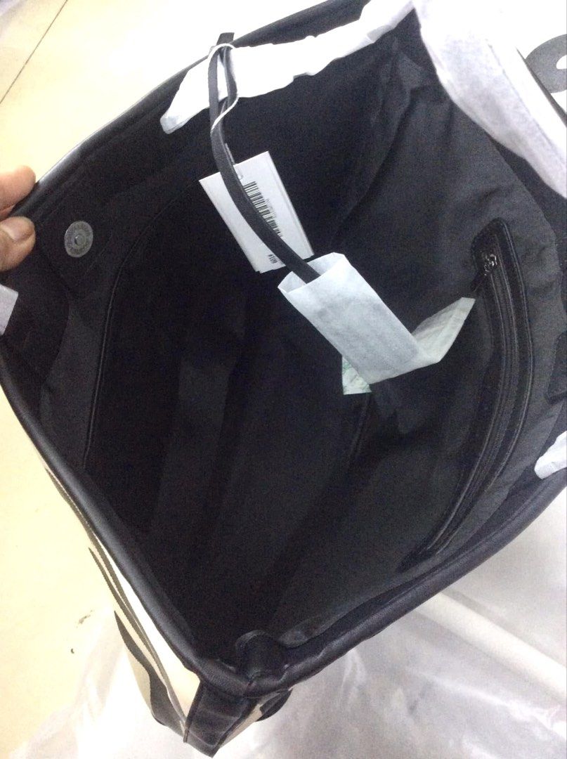 Christy Ng Logo Tote Bag (Category: Tote Bags) located in Bulacan. Submitted by mykakarizza (Listing ID 1459051622, Image 2). Description: NEW RELEASE✨✨ ₱980 only Christy Ng Logo Tote Bag Magnetic button closure 1 compartment, 1 zip pocket & 2 slip pocket 18" (L) x 11.5" (H) x 4.5" (W) Add paperbag 100 📸 Actual pics! 🙋🏻‍♀️.