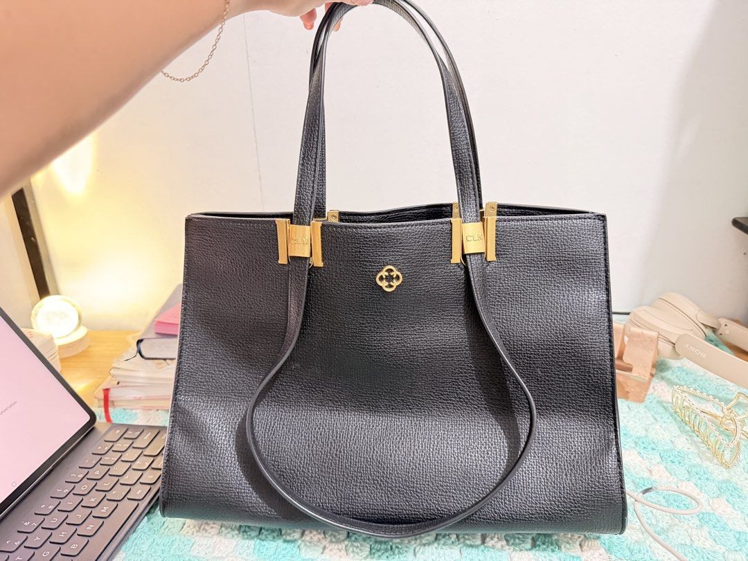 CLN tote bag (Category: Tote Bags) located in Manila. Submitted by jeanne0726 (Listing ID 1458898305, Image 1). Description: - Brand: CLN - Color: Black - Material: Textured - Hardware: Gold - Interior: Multiple compartments, zippered pockets, red lining - Condition: Clean interior - Use: Daily essentials, work, casual outings.