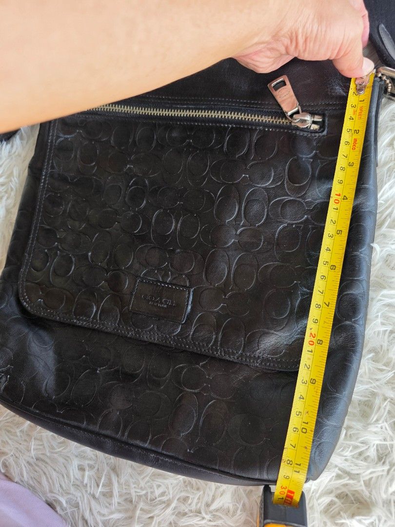 Coach Black Leather Embossed Monogram Messenger Crossbody Bag (Category: Cross-body Bags) located in Lemery. Submitted by venus23 (Listing ID 1458940983, Image 2). Description: - Coach black leather crossbody bag - Features signature C monogram embossed all over - Front flap with zippered pocket - Spacious main compartment - Adjustable strap for comfortable wear - Ideal for everyday use - Approximate dimensions: 10" wide x 11" tall.