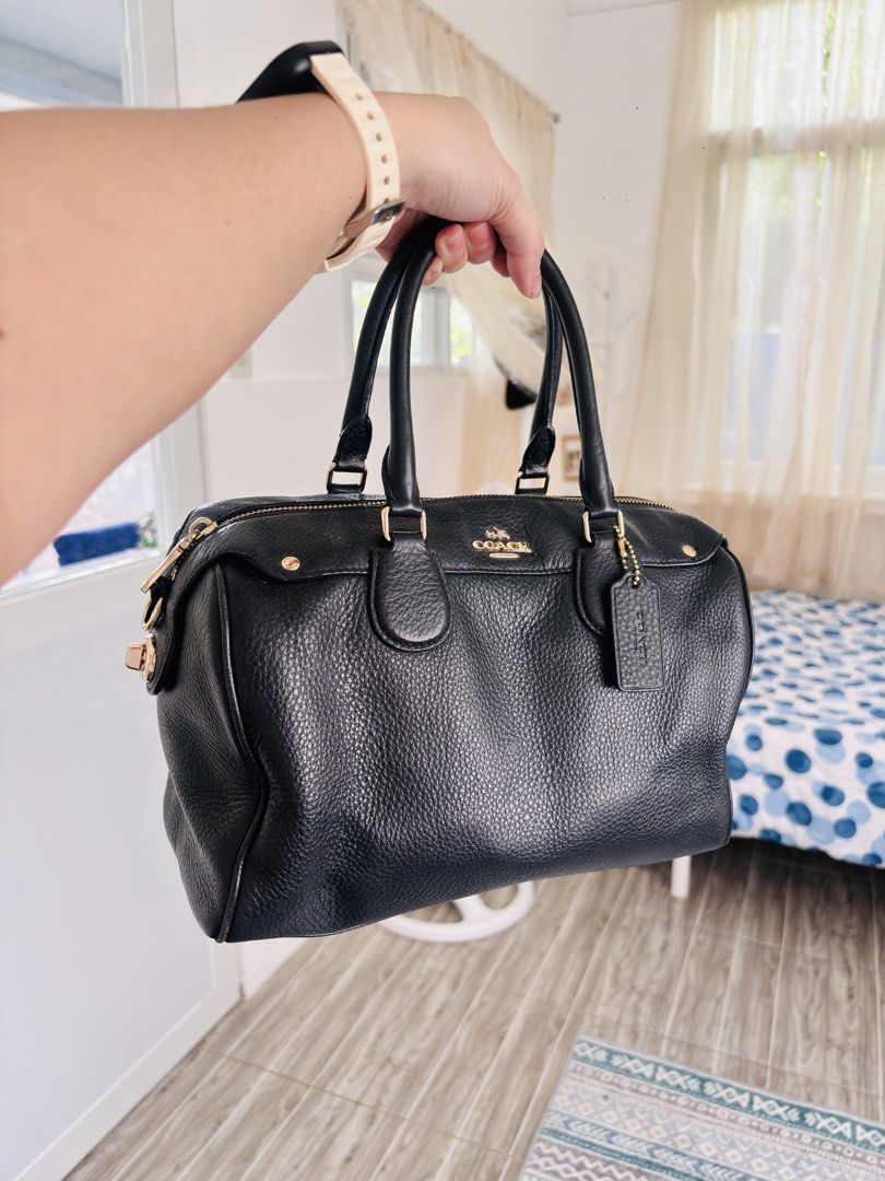 Coach Black Leather Satchel Bag (Category: Luxury Bags & Wallets) located in Quezon City. Submitted by itsmeriaa (Listing ID 1458903419, Image 3). Description: - Classic black Coach satchel - Pebbled leather exterior - Gold hardware details - Top handles and zip closure - Interior zip and slip pockets - Comes with Coach leather tag - Ideal for everyday use.