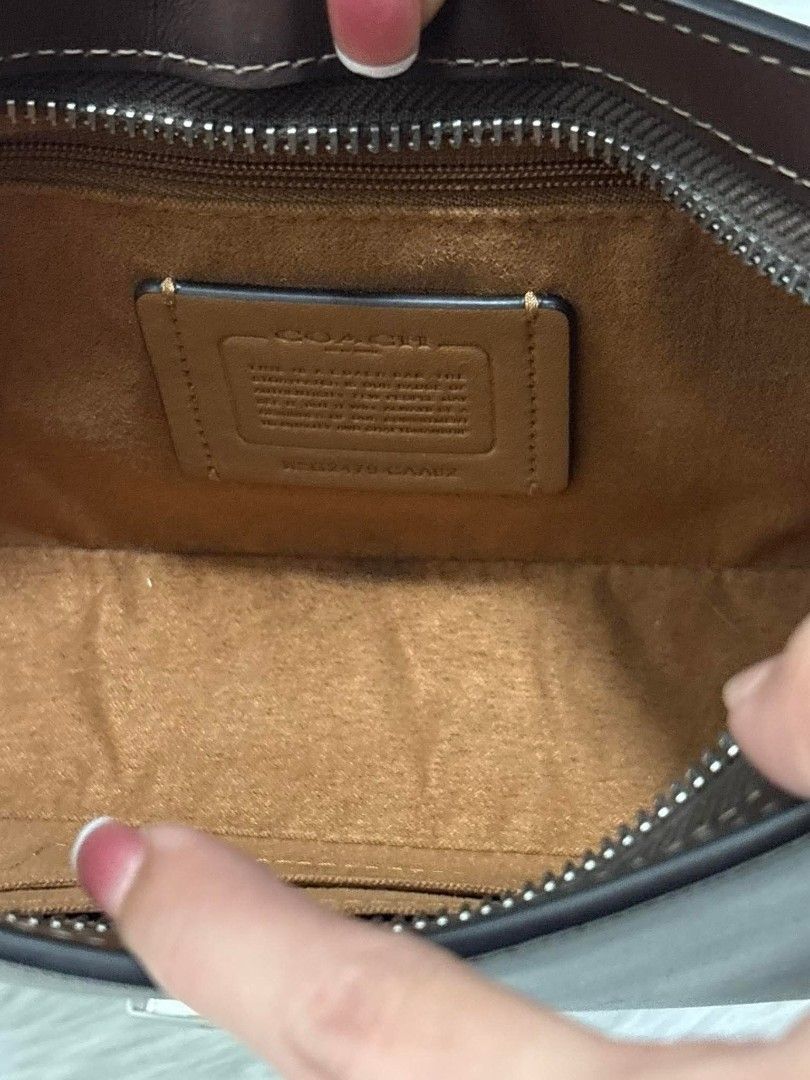 Coach Eliza Shoulder Bag (Brown) (Category: Luxury Bags & Wallets) located in Manila. Submitted by seresa_04 (Listing ID 1458902704, Image 3). Description: - Classic brown leather shoulder bag by Coach - Simple and chic design - Interior zippered pocket - Adjustable strap for comfort - Ideal for everyday use - Perfectly fits your essentials.