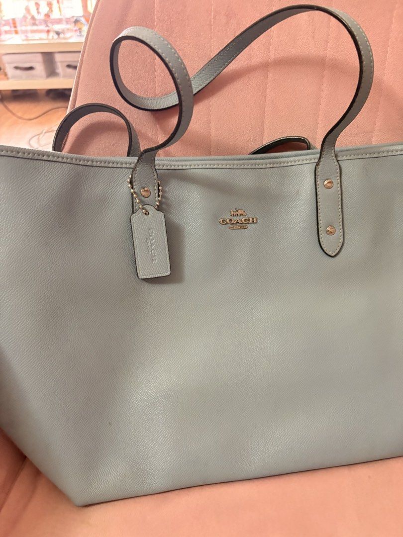 Coach Light Blue Leather Tote Bag (Category: Luxury Bags & Wallets) located in Paranaque City. Submitted by aihp20 (Listing ID 1458920104, Image 1). Description: - Authentic Coach tote bag - Chic light blue leather - Signature Coach logo and hanging tag - Interior: 1 zippered pocket, slip pockets - Note: Some marks inside the bag.