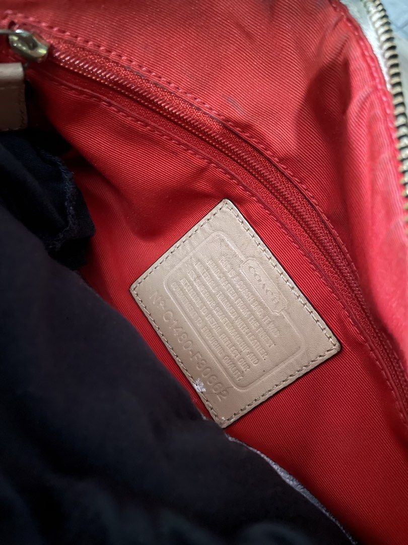 Coach Monogram Speedy Bag with Red Stripe (Category: Luxury Bags & Wallets) located in Buenavista. Submitted by ivoperez27 (Listing ID 1459004126, Image 2). Description: - Authentic brown Coach monogram speedy bag - Eye-catching red and white stripe detail on the front - Classic beige leather trim and handles - Vibrant red interior lining - Secure zipper closure - Comes with a detachable long strap for versatile wear - Minor signs of wear on the 