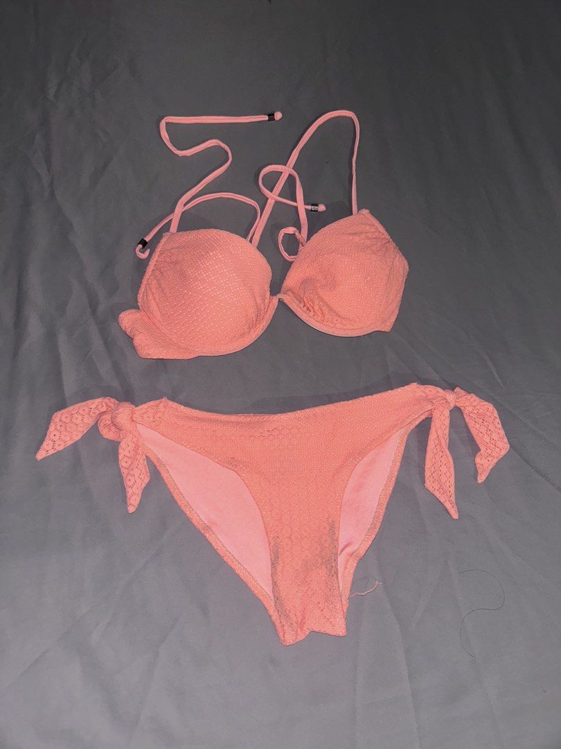 Coral Textured Bikini Set with Tie Sides (Category: Bikinis & Swimsuits) located in San Juan City. Submitted by mimilove17 (Listing ID 1458942367, Image 1). Description: - Cute coral bikini set - Textured fabric all over - Adjustable halter top with tie-back - Adjustable tie-side bottoms - Ideal for beach, pool, or vacation.