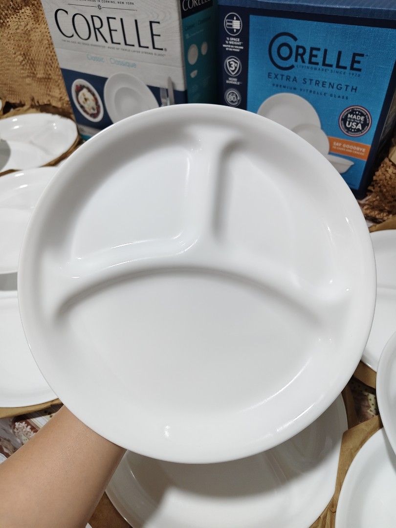 Corelle Divided Plates (Category: Dinnerware & Cutlery) located in Angeles City. Submitted by kalacutie (Listing ID 1459014788, Image 2). Description: Corelle® Winter Frost White 10.25" Divided Dinner Plate features a clean white design and convenient divided sections. Made with durable Vitrelle® triple-layer glass, this lightweight plate resists chips and cracks while remaining easy to handle and stack. Its three-section layout helps keep meals 