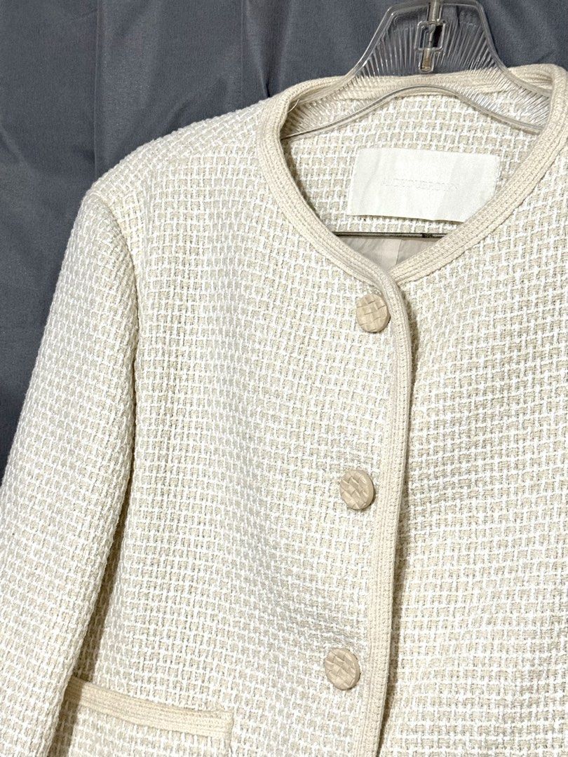 Cream Cropped Tweed Jacket (Category: Coats, Jackets and Outerwear) located in Pasay City. Submitted by janatrisha (Listing ID 1458965585, Image 2). Description: Cream cropped tweed jacket - Round neckline with button closure - Textured button finish - Lined interior Size: fits up to Large Delivery c/o buyer.