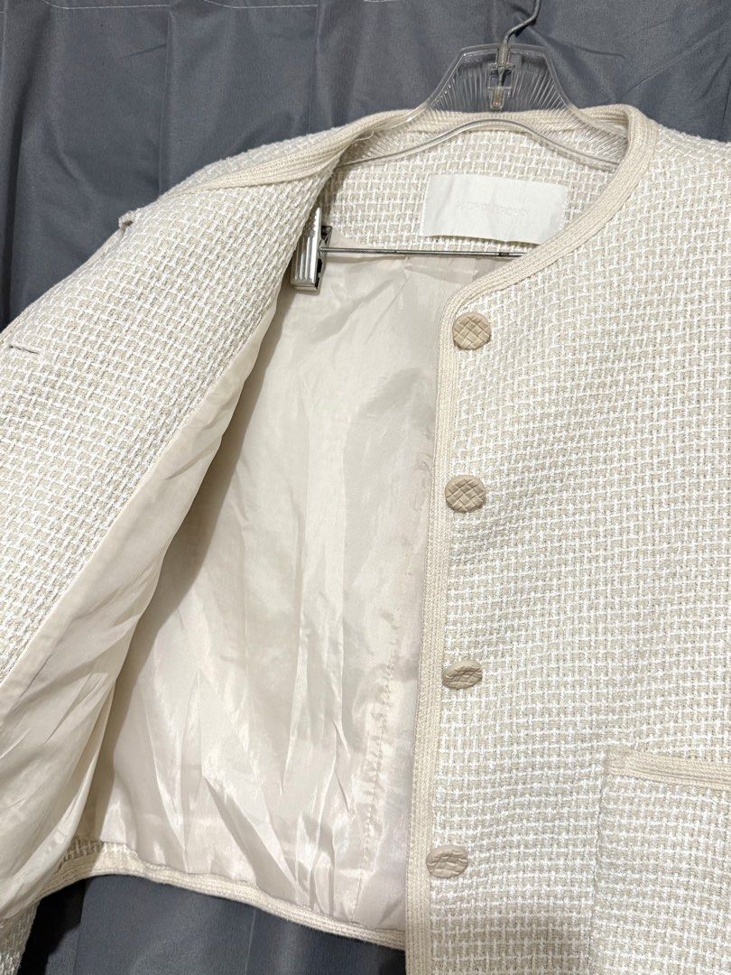 Cream Cropped Tweed Jacket (Category: Coats, Jackets and Outerwear) located in Pasay City. Submitted by janatrisha (Listing ID 1458965585, Image 3). Description: Cream cropped tweed jacket - Round neckline with button closure - Textured button finish - Lined interior Size: fits up to Large Delivery c/o buyer.